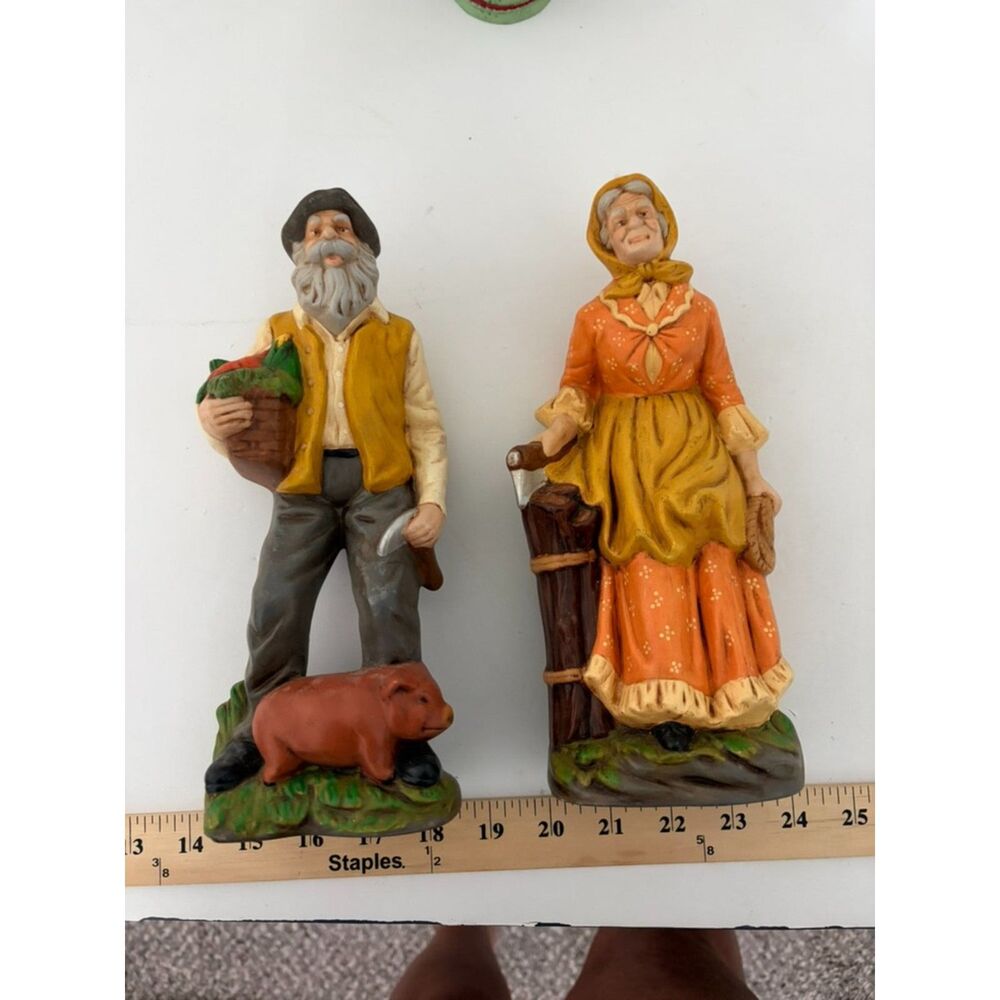 2 vintage ceramic figures of old man and woman farmer with pig